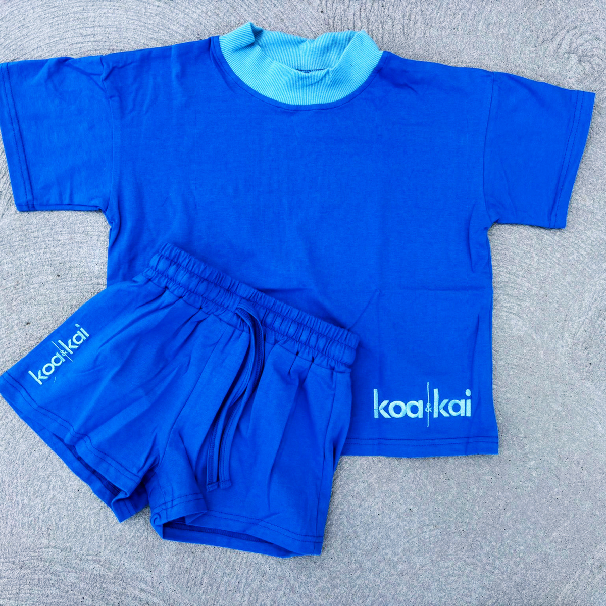 blue t shirt set flat lay koa and kai
