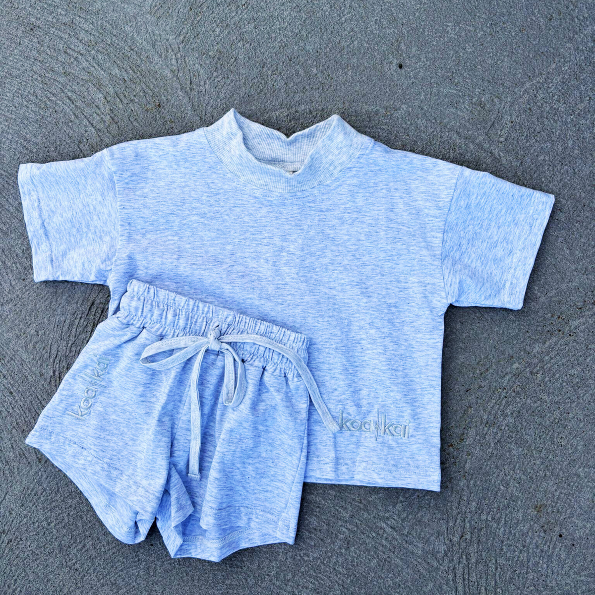 grey t shirt set flat lay driveway koa and kai