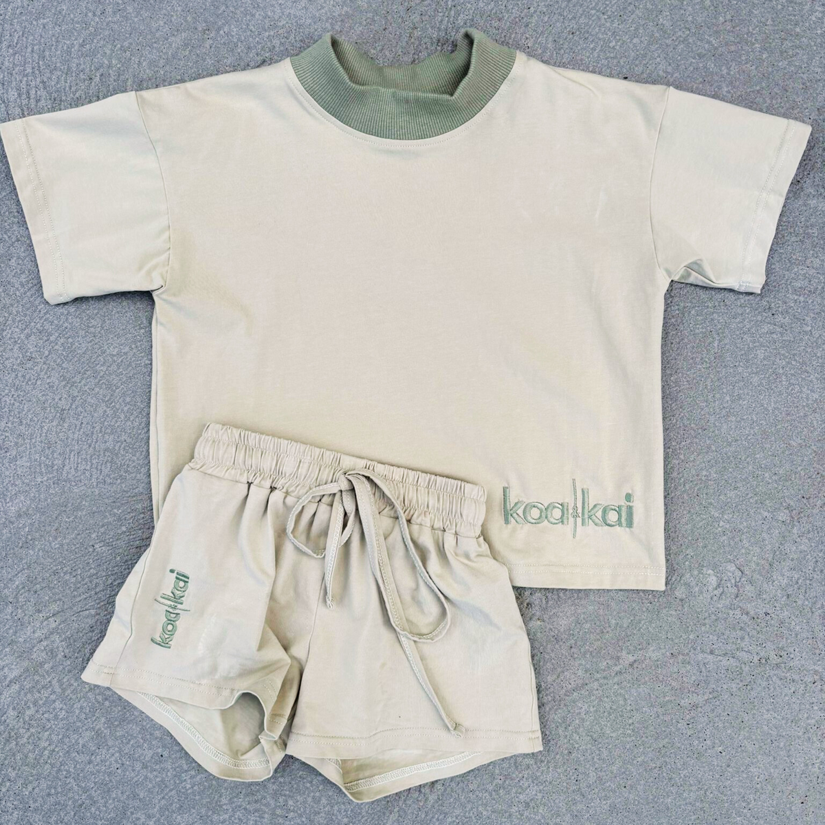 sand set koa and kai flat lay driveway