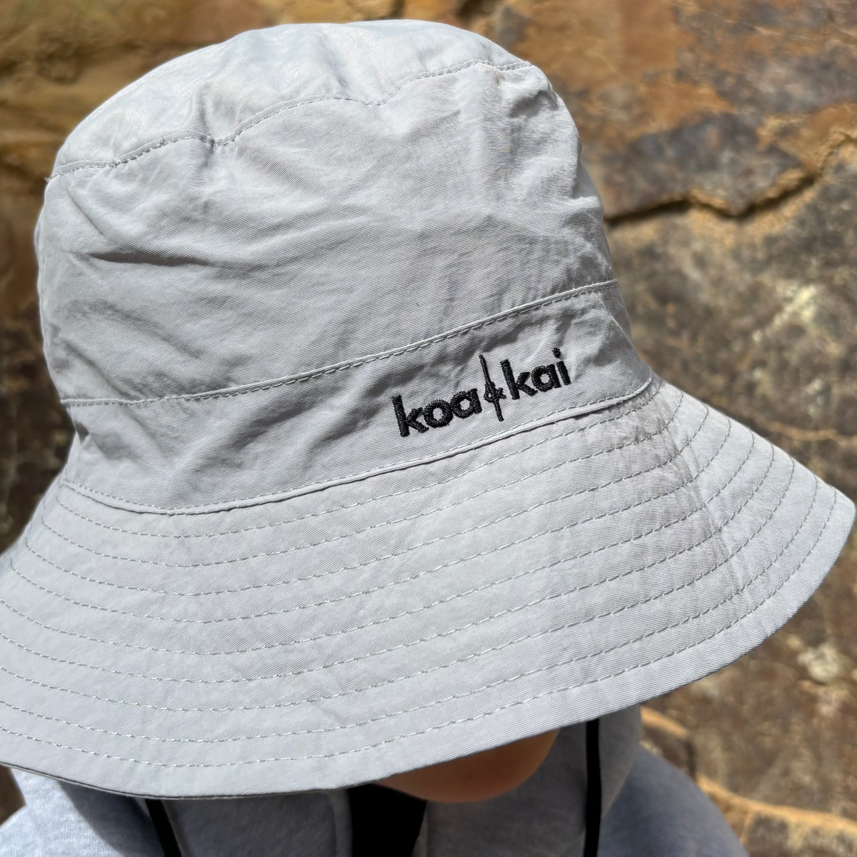 slate grey hat koa and kai face down