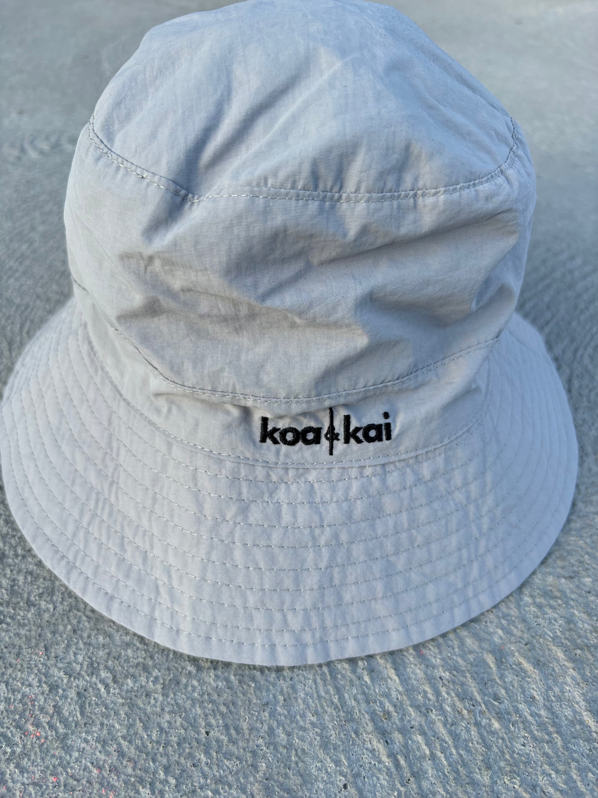 slate grey hat koa and kai hat on floor